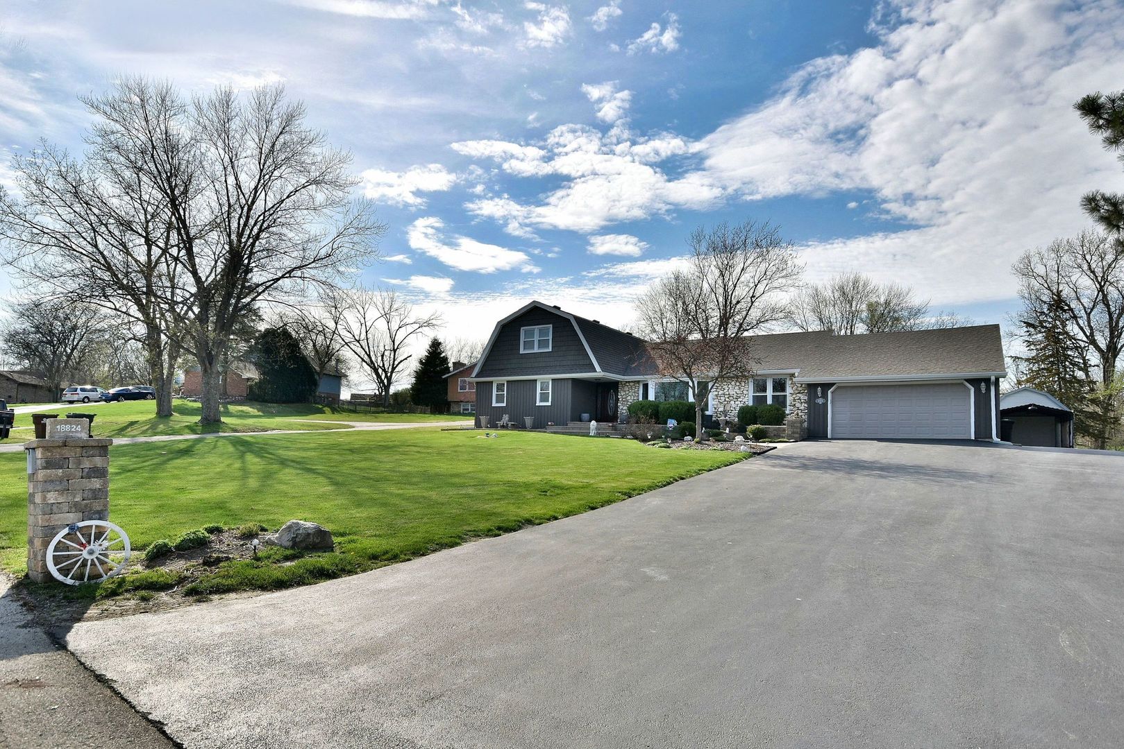 18824 Ruth Drive Mokena, IL 60448 - Photo 2 of 29 a view of a house with a big yard plants and large trees