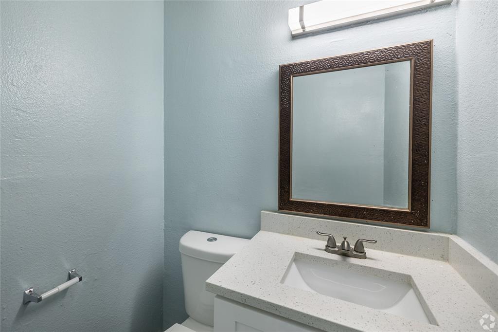 313 Rolston Road, Unit 315102 Irving, TX 75060 - Photo 7 of 8 Bathroom vanity featuring a light-toned countertop with integrated sink and brushed nickel faucet