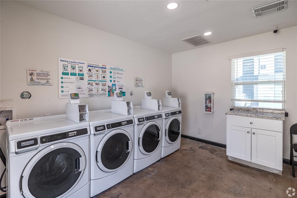 313 Rolston Road, Unit 315102 Irving, TX 75060 - Photo 8 of 8 Laundry facility featuring multiple front-loading washers and dryers