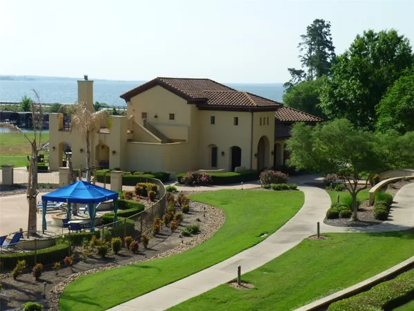 a view of a balcony with chairs and a fire pit
