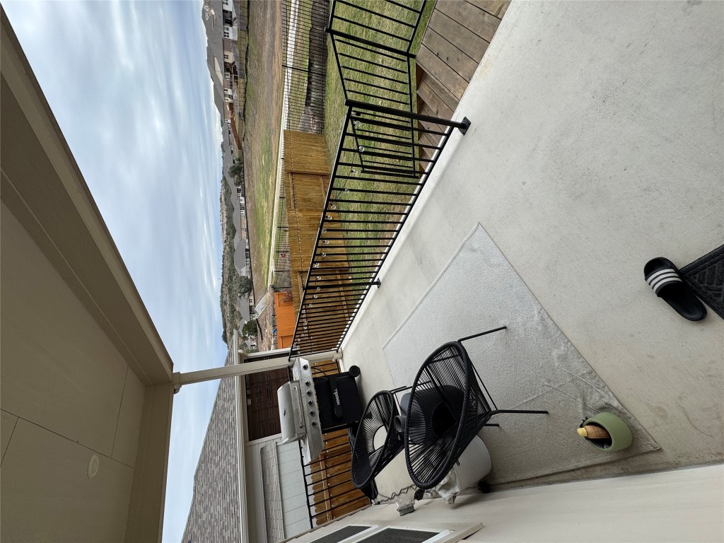 429 El Capitan Loop Dripping Springs, TX 78620 - Photo 15 of 18 Backyard patio featuring overlooking a grassy fenced-in yard