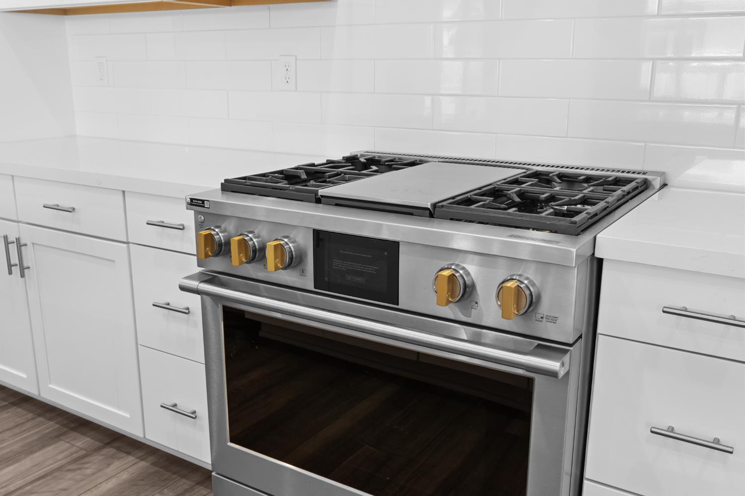4236 Bellwether Way Sacramento, CA 95835 - Photo 15 of 57 a stove top oven sitting inside of a kitchen