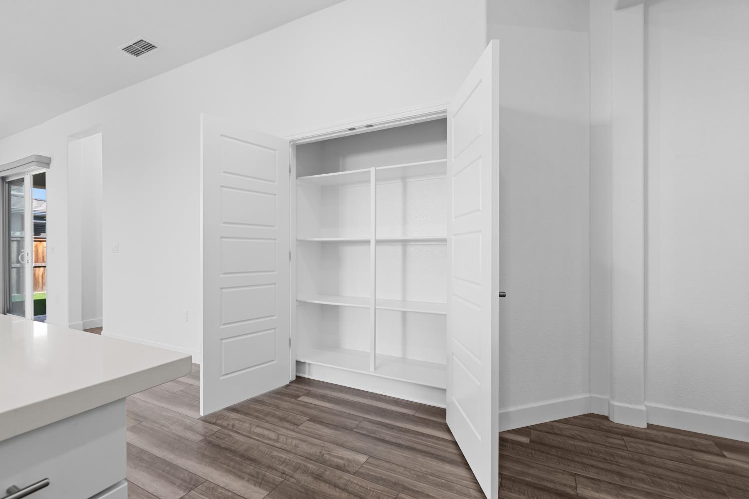 4236 Bellwether Way Sacramento, CA 95835 - Photo 16 of 57 a view of a room with wooden floor