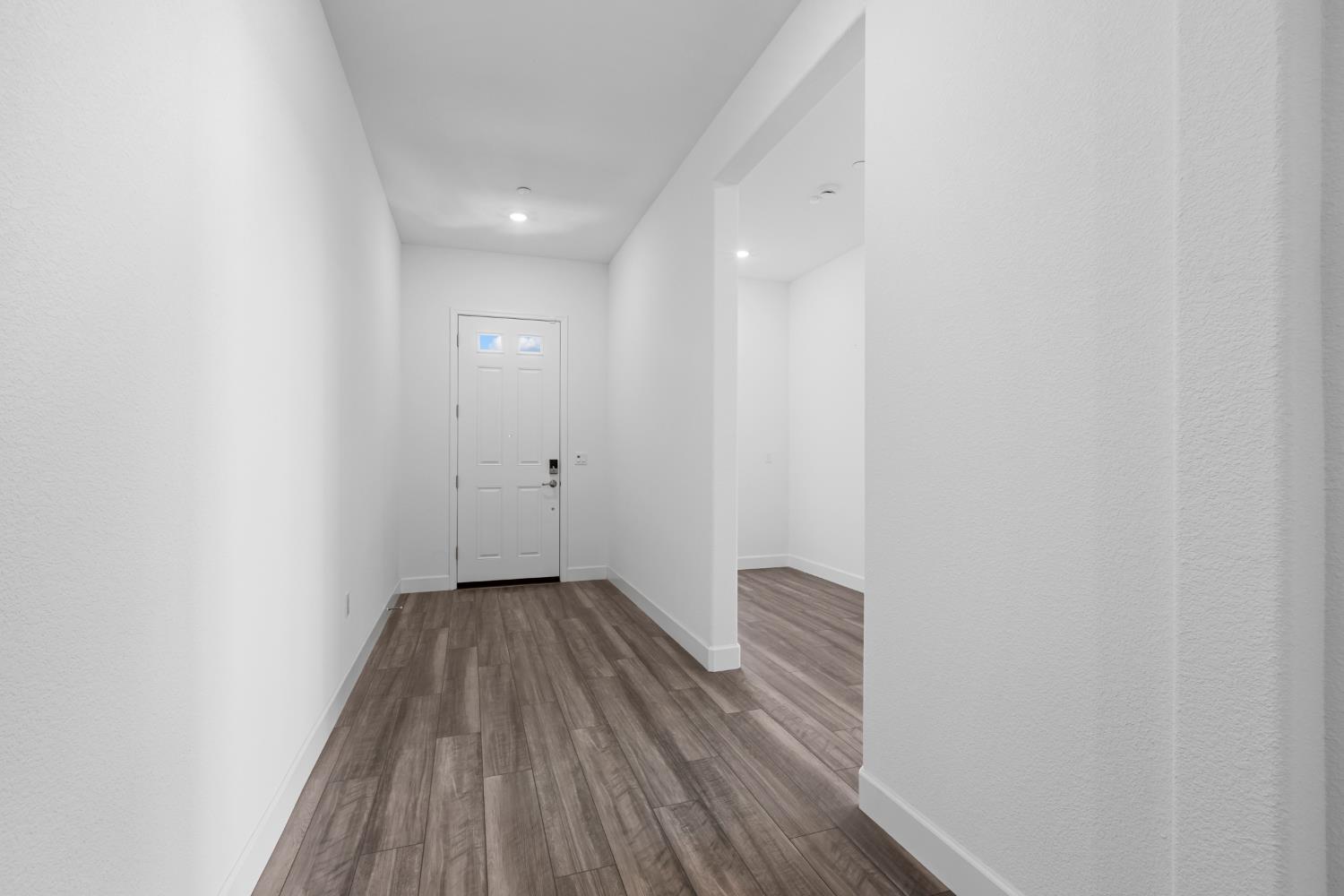 4236 Bellwether Way Sacramento, CA 95835 - Photo 17 of 57 a view of a hallway with wooden floor
