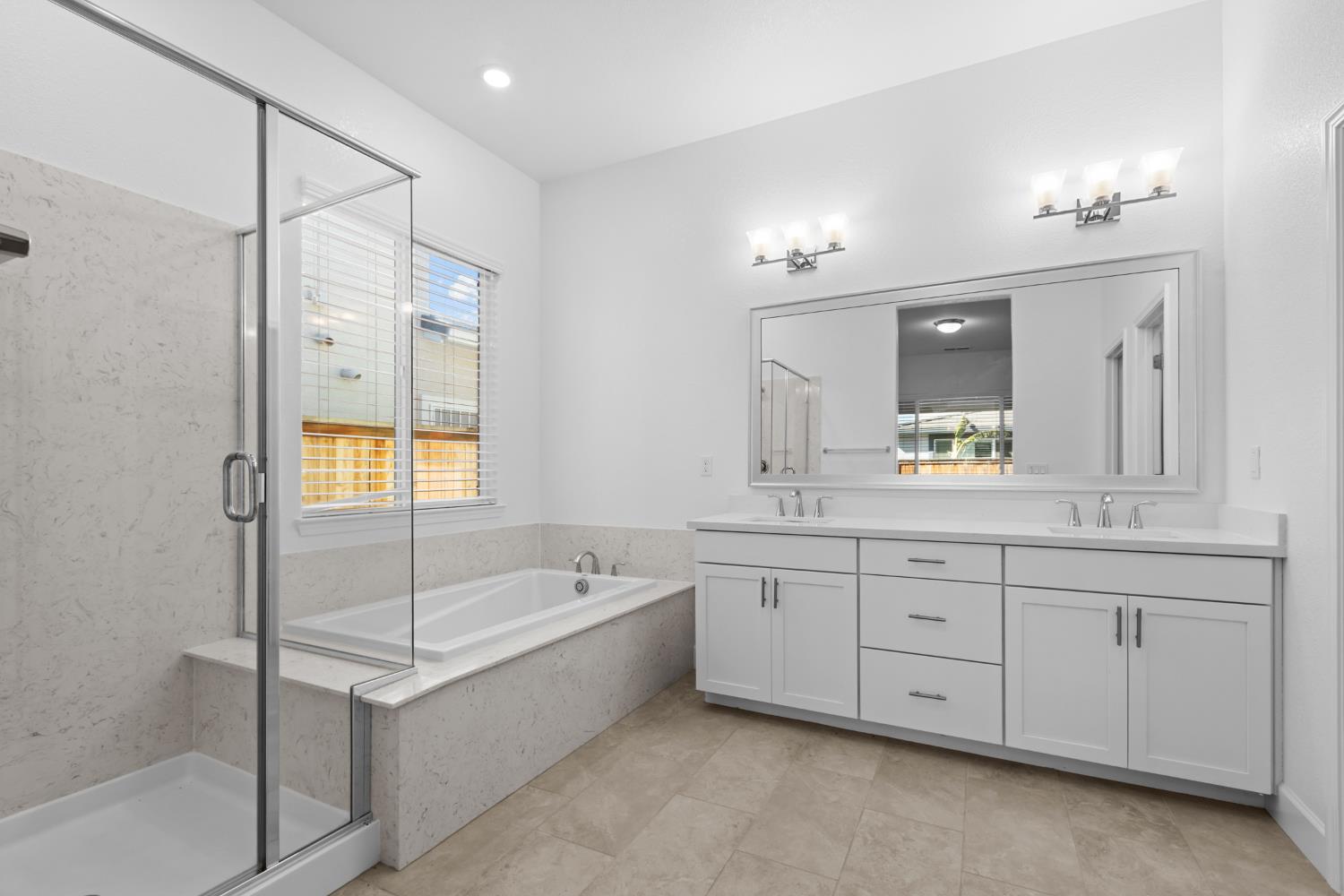 4236 Bellwether Way Sacramento, CA 95835 - Photo 21 of 57 a bathroom with a tub sink shower and mirror