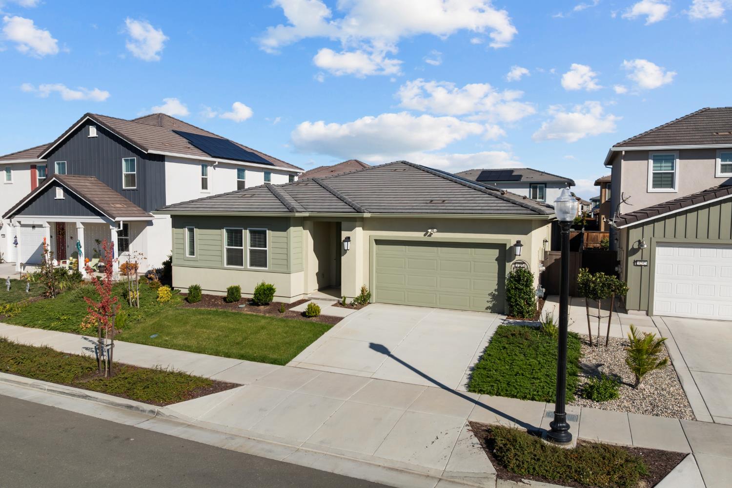 4236 Bellwether Way Sacramento, CA 95835 - Photo 3 of 57 a front view of a house with garden