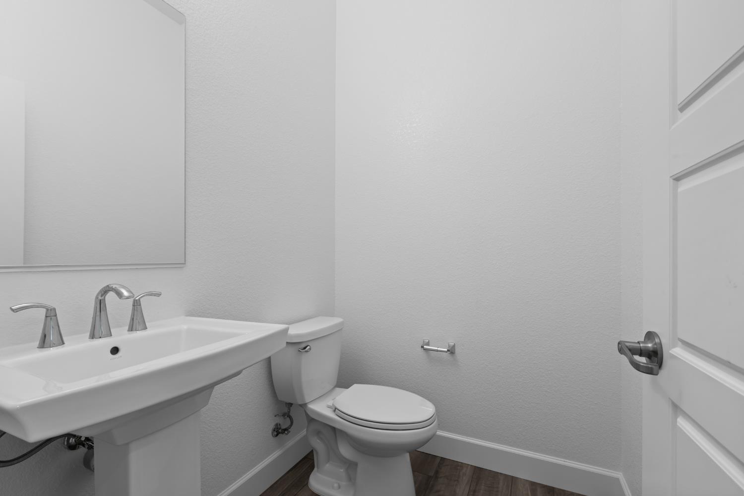 4236 Bellwether Way Sacramento, CA 95835 - Photo 34 of 57 a bathroom with a sink toilet and a mirror