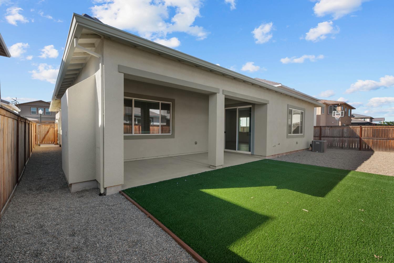 4236 Bellwether Way Sacramento, CA 95835 - Photo 38 of 57 a view of a backyard with table and chairs and garden