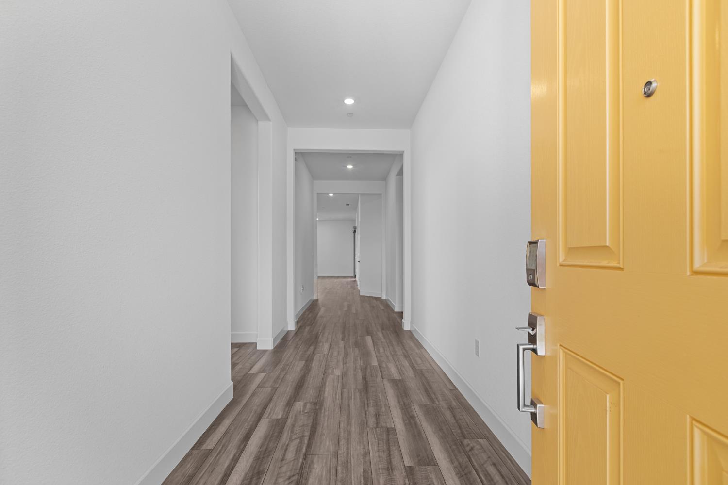 4236 Bellwether Way Sacramento, CA 95835 - Photo 5 of 57 a view of a hallway with wooden floor