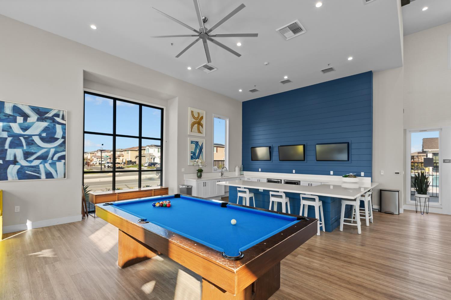 4236 Bellwether Way Sacramento, CA 95835 - Photo 54 of 57 a living room with stainless steel appliances kitchen island granite countertop furniture and a wooden floor