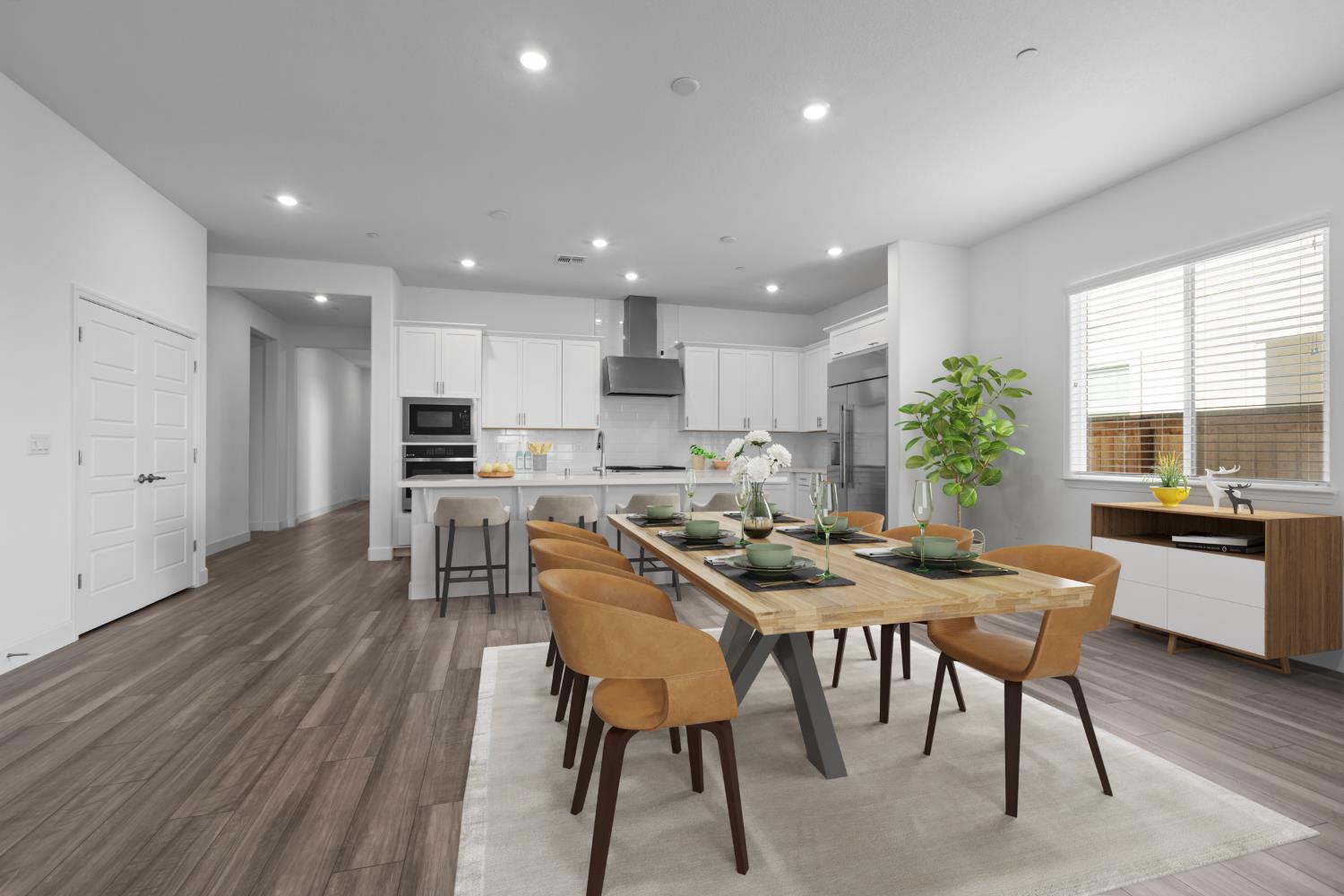 4236 Bellwether Way Sacramento, CA 95835 - Photo 8 of 57 a view of a dining room with furniture and wooden floor