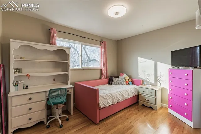 a bedroom with a bed and a cabinets