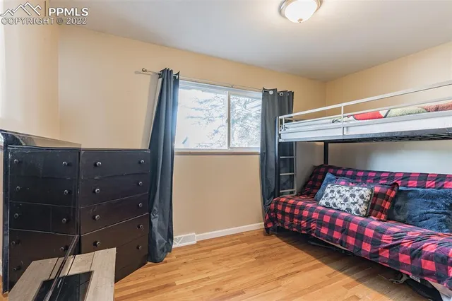 a bedroom with a bed and a dresser