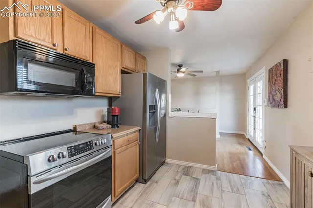 a kitchen with a stove microwave and refrigerator