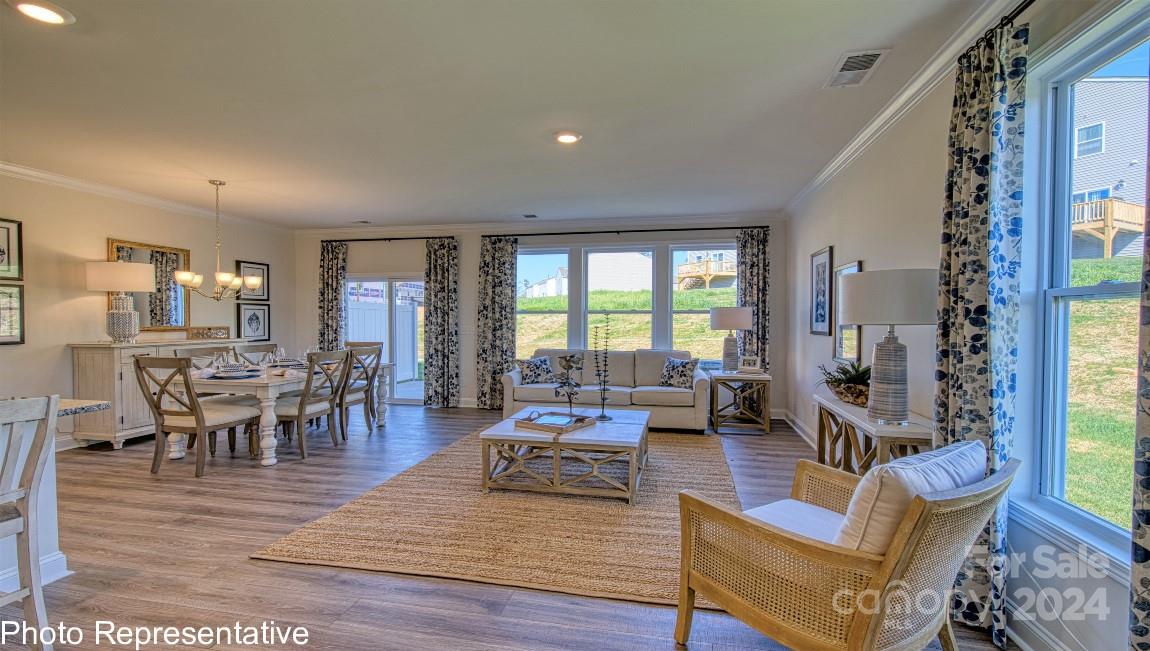 542 Wheatfield Road Fletcher, NC 28732 - Photo 13 of 47 a living room with furniture dining table and a large window