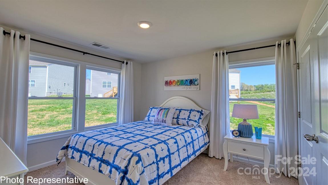 542 Wheatfield Road Fletcher, NC 28732 - Photo 39 of 47 a bedroom with a bed and a window