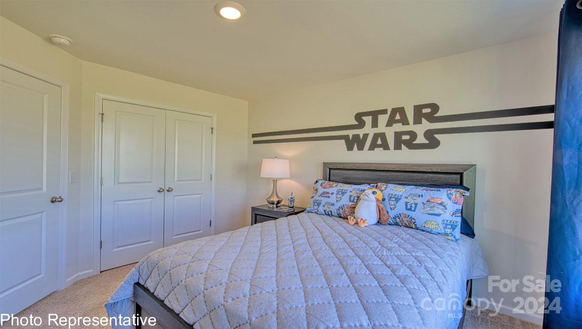 542 Wheatfield Road Fletcher, NC 28732 - Photo 47 of 47 a bedroom with a bed and a night stand
