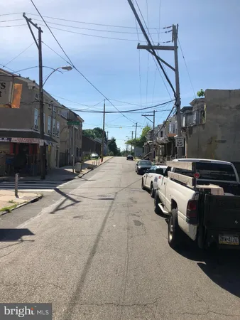 a view of a street with cars