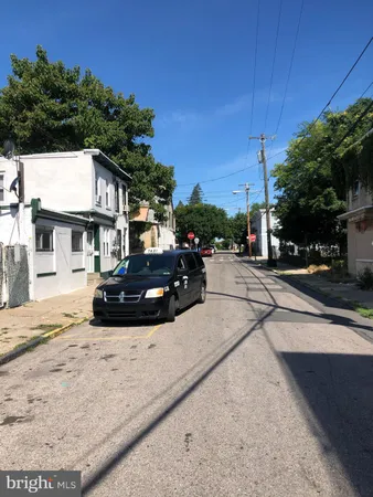a view of street with parked cars
