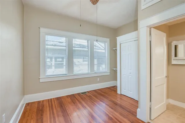a bathroom with a sink vanity mirror and toilet