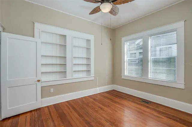 a view of a hallway with the wooden floor