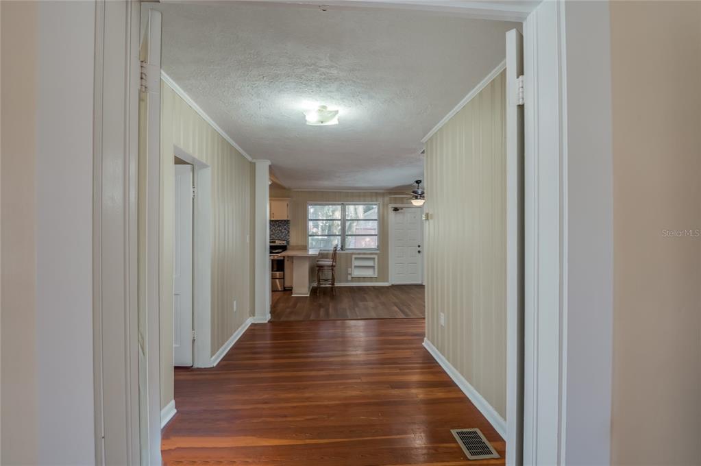 427 East Washington Avenue Eustis, FL 32726 - Photo 26 of 42 a view of a hallway with the wooden floor