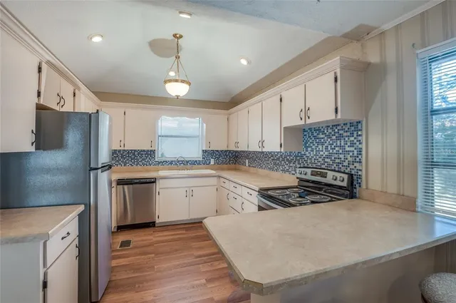 a bathroom with a granite countertop toilet sink and shower