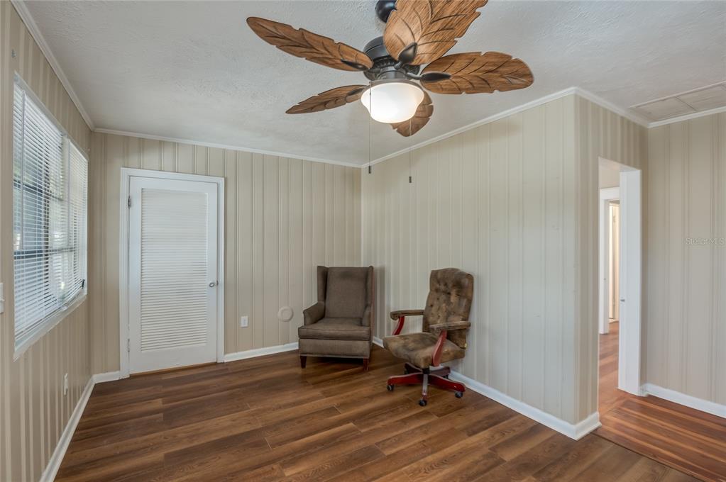 427 East Washington Avenue Eustis, FL 32726 - Photo 31 of 42 a view of workspace with wooden floor and lounge chair