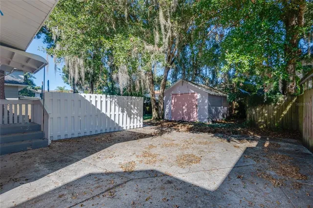 a backyard of a house with lots of green space