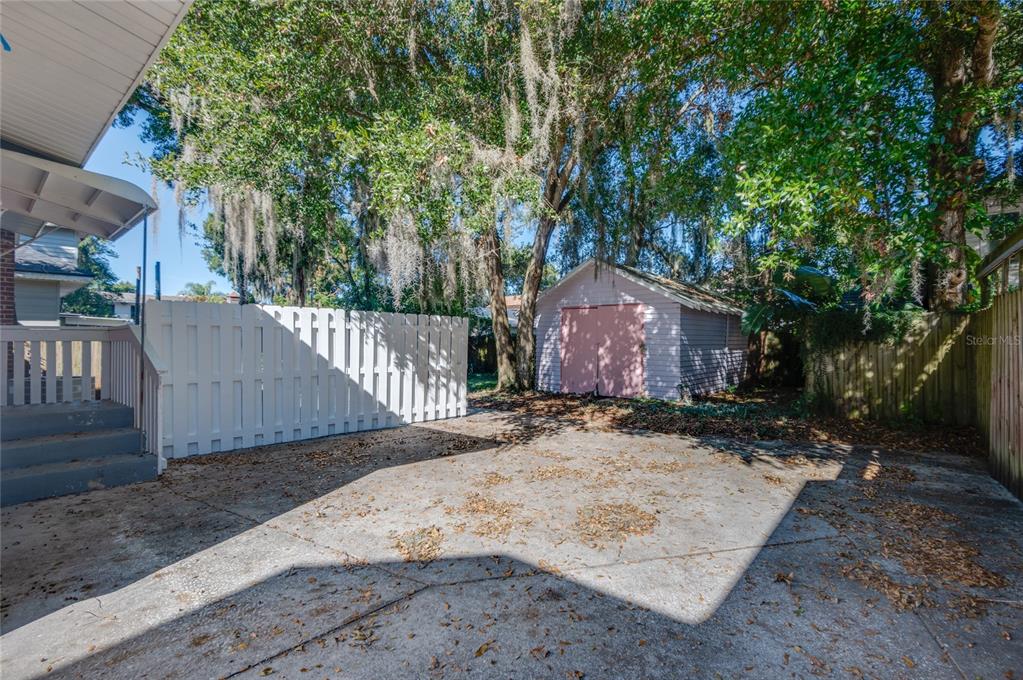 427 East Washington Avenue Eustis, FL 32726 - Photo 33 of 42 a front view of a house with a yard and garage