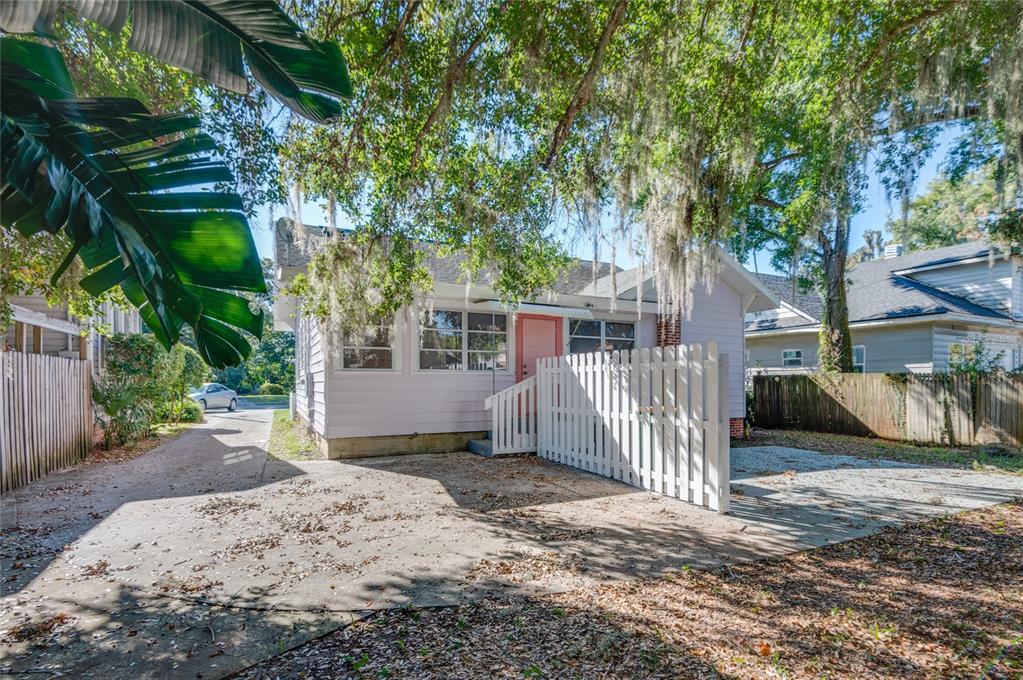 427 East Washington Avenue Eustis, FL 32726 - Photo 37 of 42 a view of a house with a yard and tree
