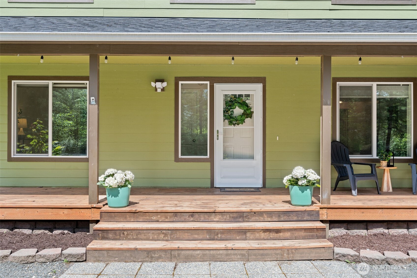401 East Sunset Ridge Road Union, WA 98592 - Photo 24 of 37 a front view of a house with potted plants