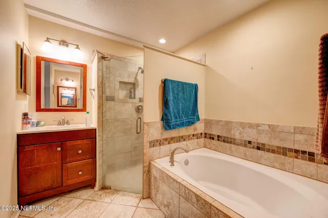 a bathroom with a bathtub and a sink
