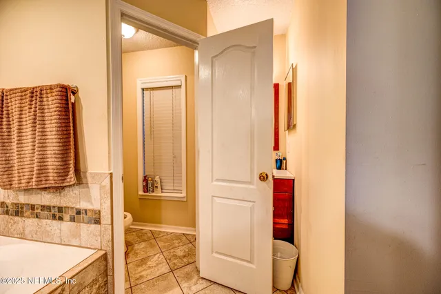 a bathroom with a tub and shower