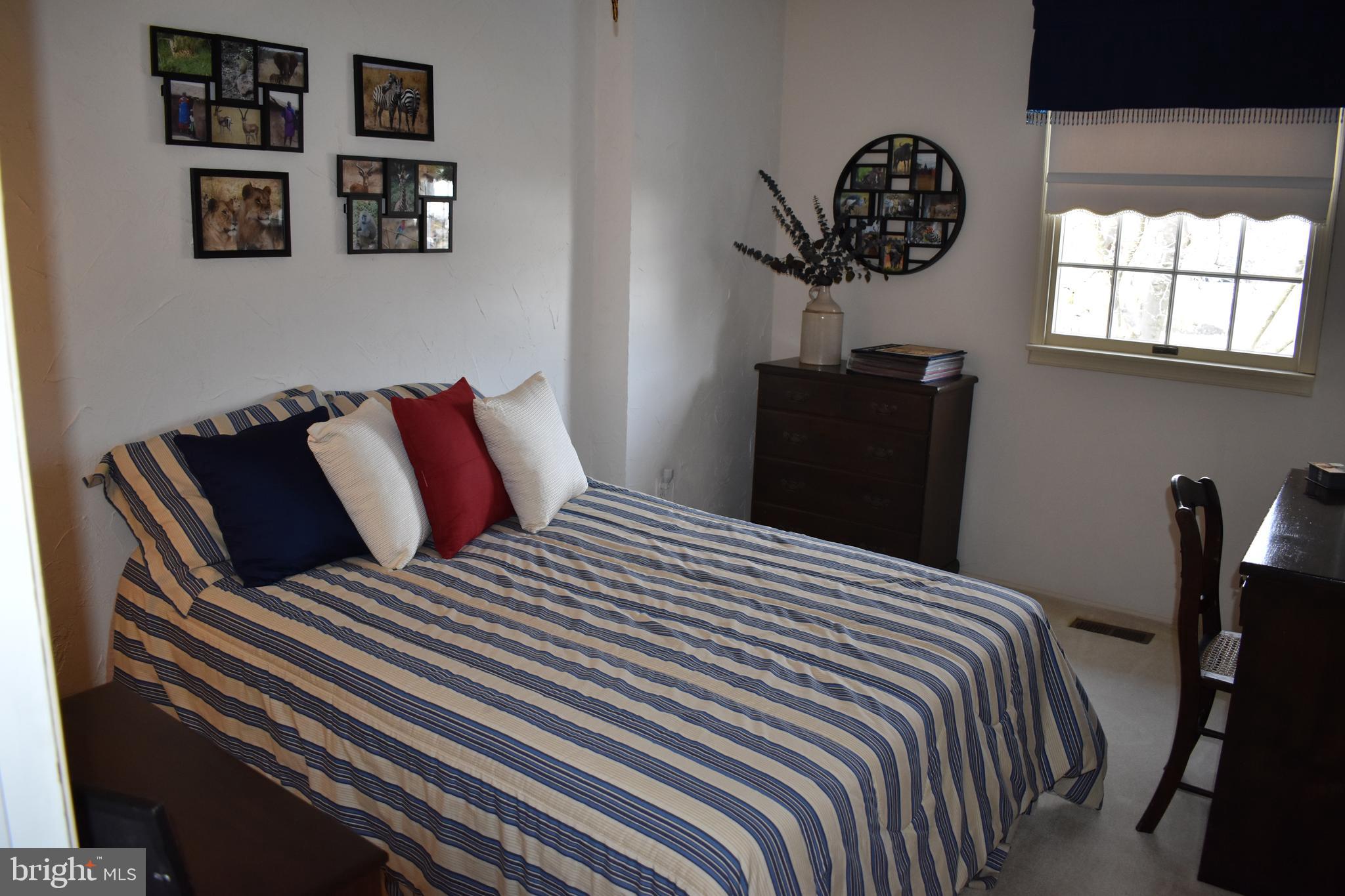 4420 Wynn Road Baltimore, MD 21236 - Photo 23 of 43 a bedroom with a bed and a chandelier