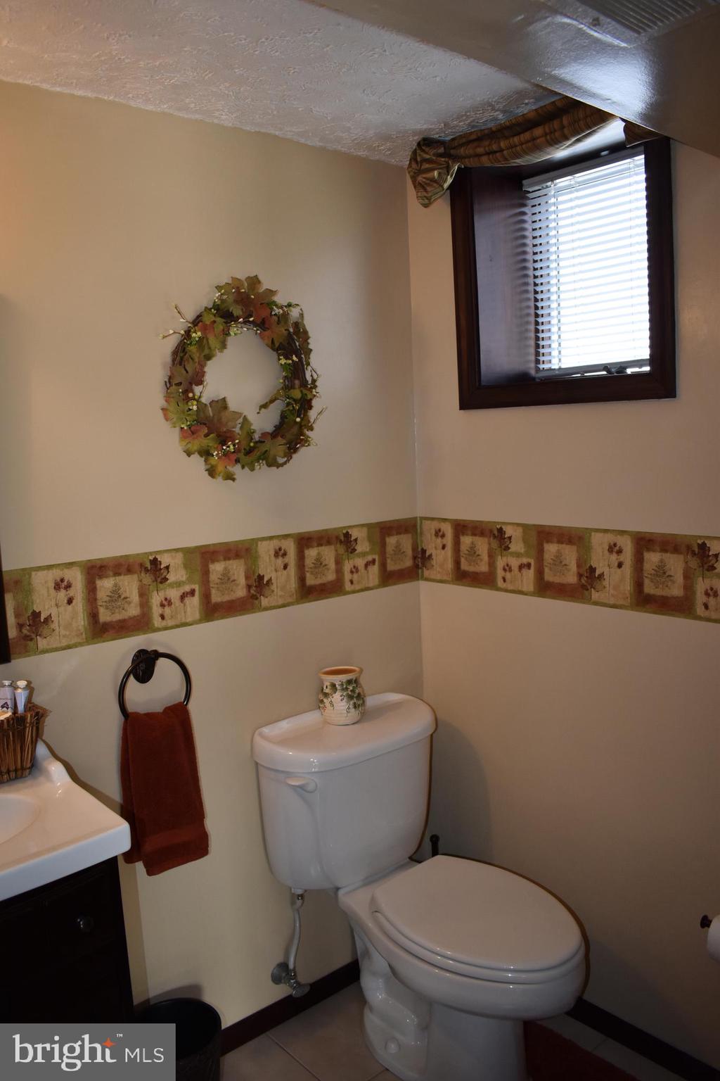 4420 Wynn Road Baltimore, MD 21236 - Photo 31 of 43 a bathroom with a toilet and a sink