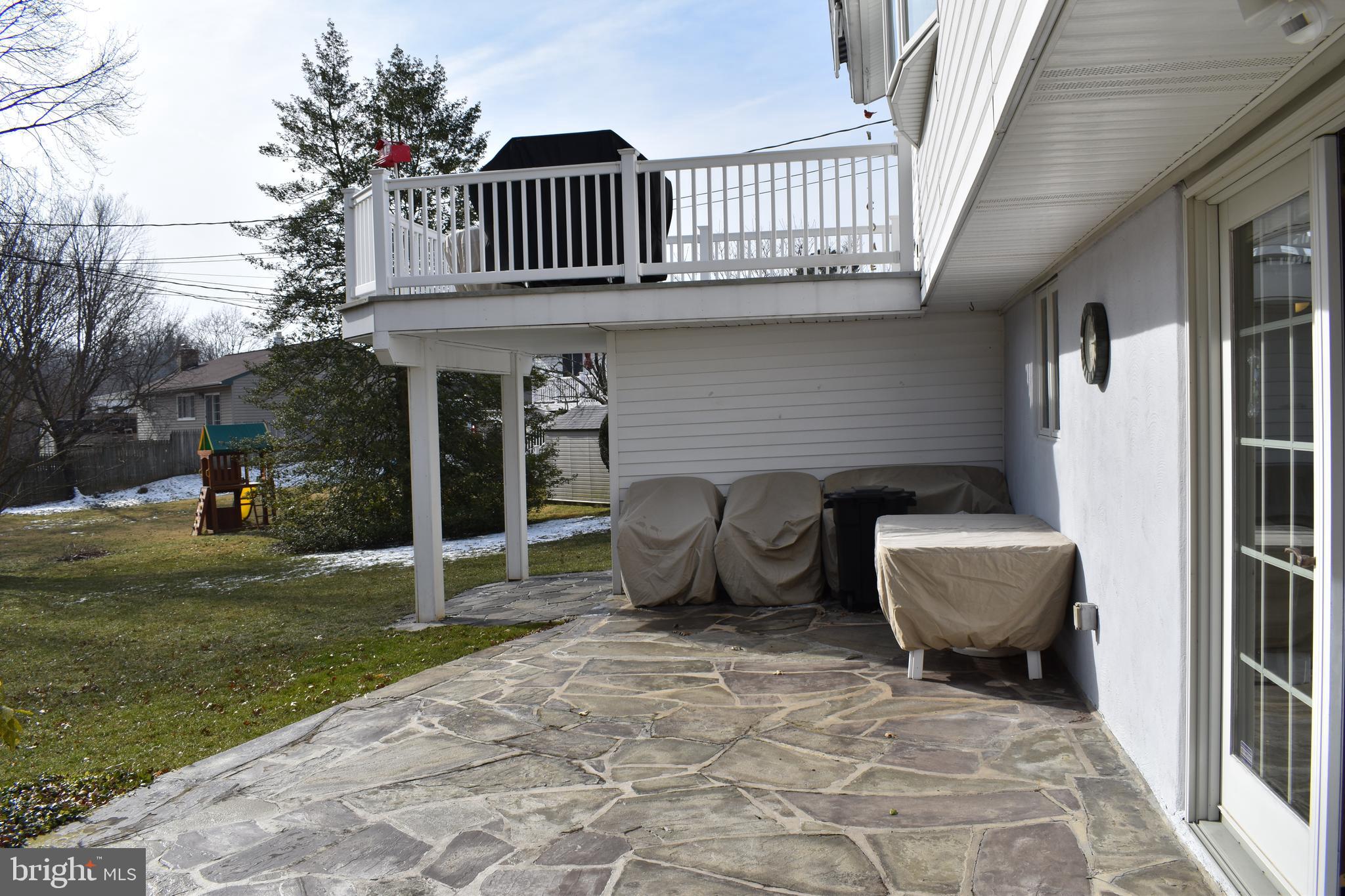 4420 Wynn Road Baltimore, MD 21236 - Photo 43 of 43 a view of a patio with a table and chairs and potted plants