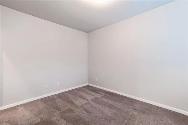 a view of a house with a small yard and stairs
