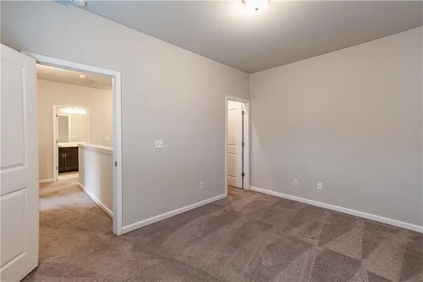 a picture of a wall with a white building