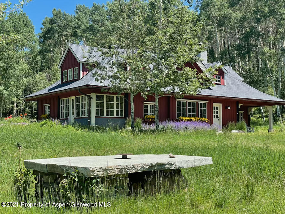 2500 Little Annie Road Aspen, CO 81612 - Photo 17 of 18 a view of a house with backyard and sitting area