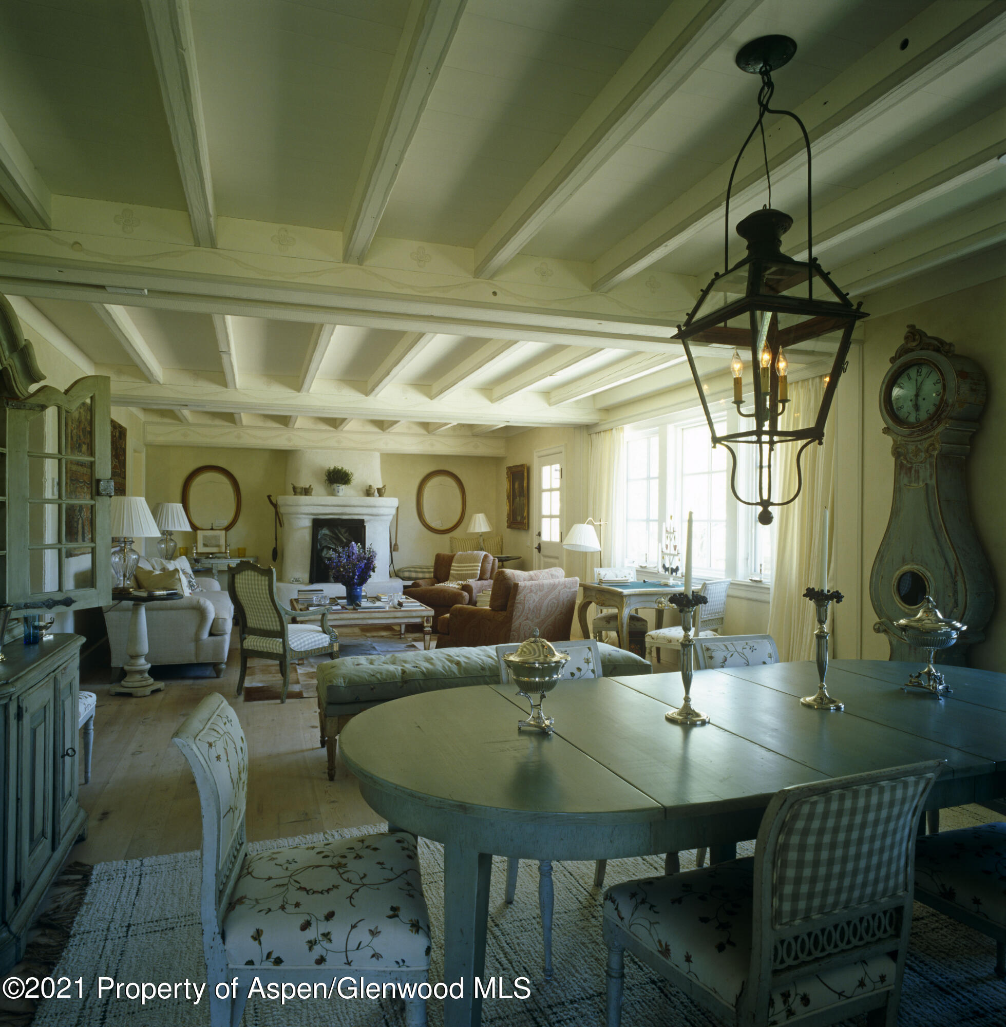 2500 Little Annie Road Aspen, CO 81612 - Photo 9 of 18 a living room with lots of furniture and a chandelier