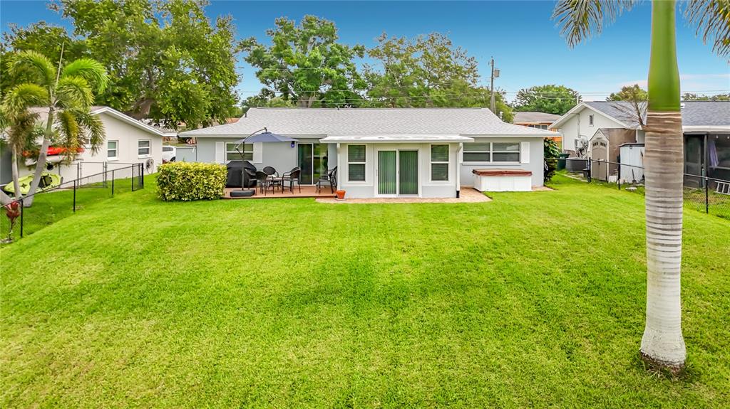 508 Shore Drive Largo, FL 33771 - Photo 24 of 31 a front view of a house with a garden