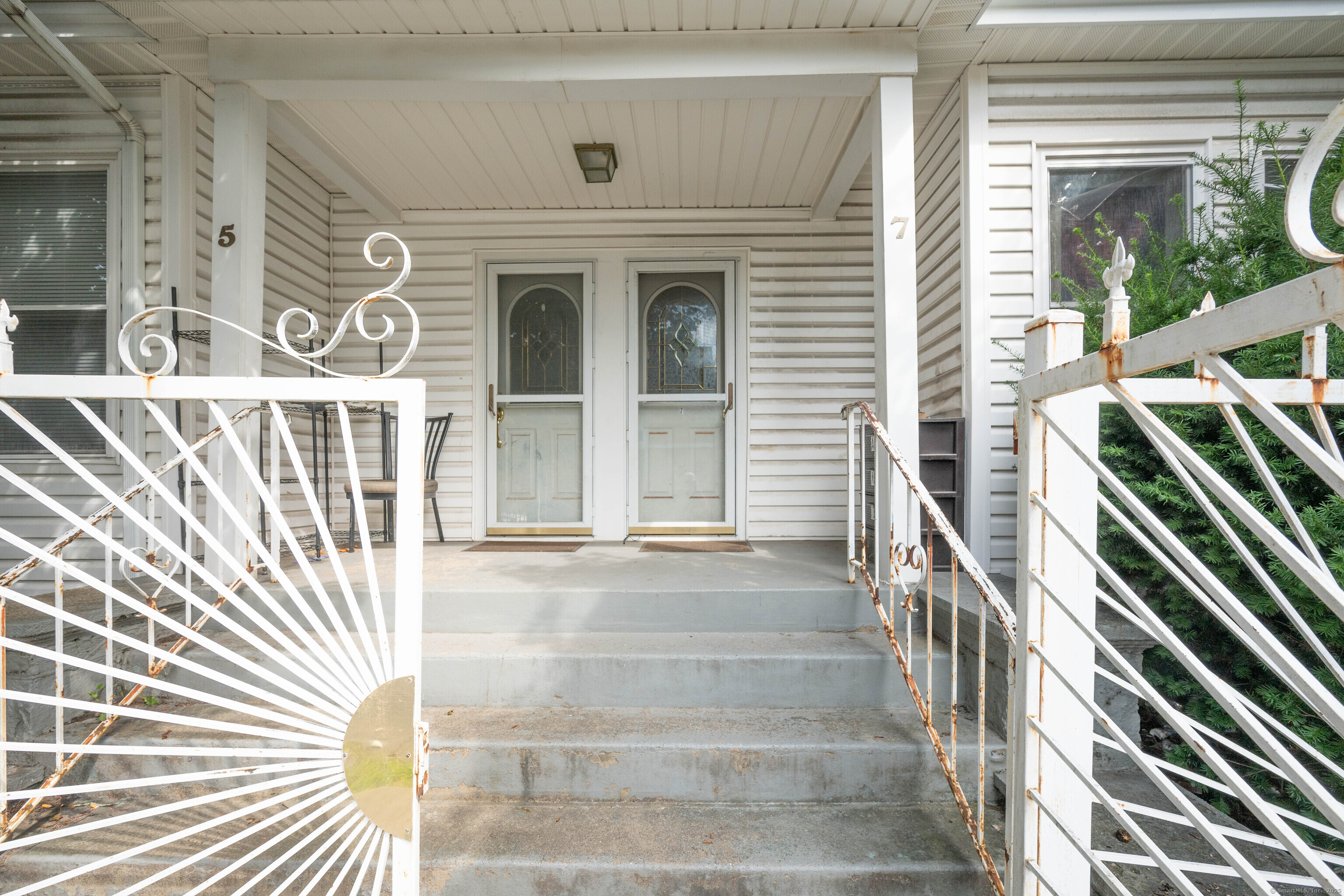 5 Patch Street Danbury, CT 06810 - Photo 5 of 21 a view of a brick house with a large windows