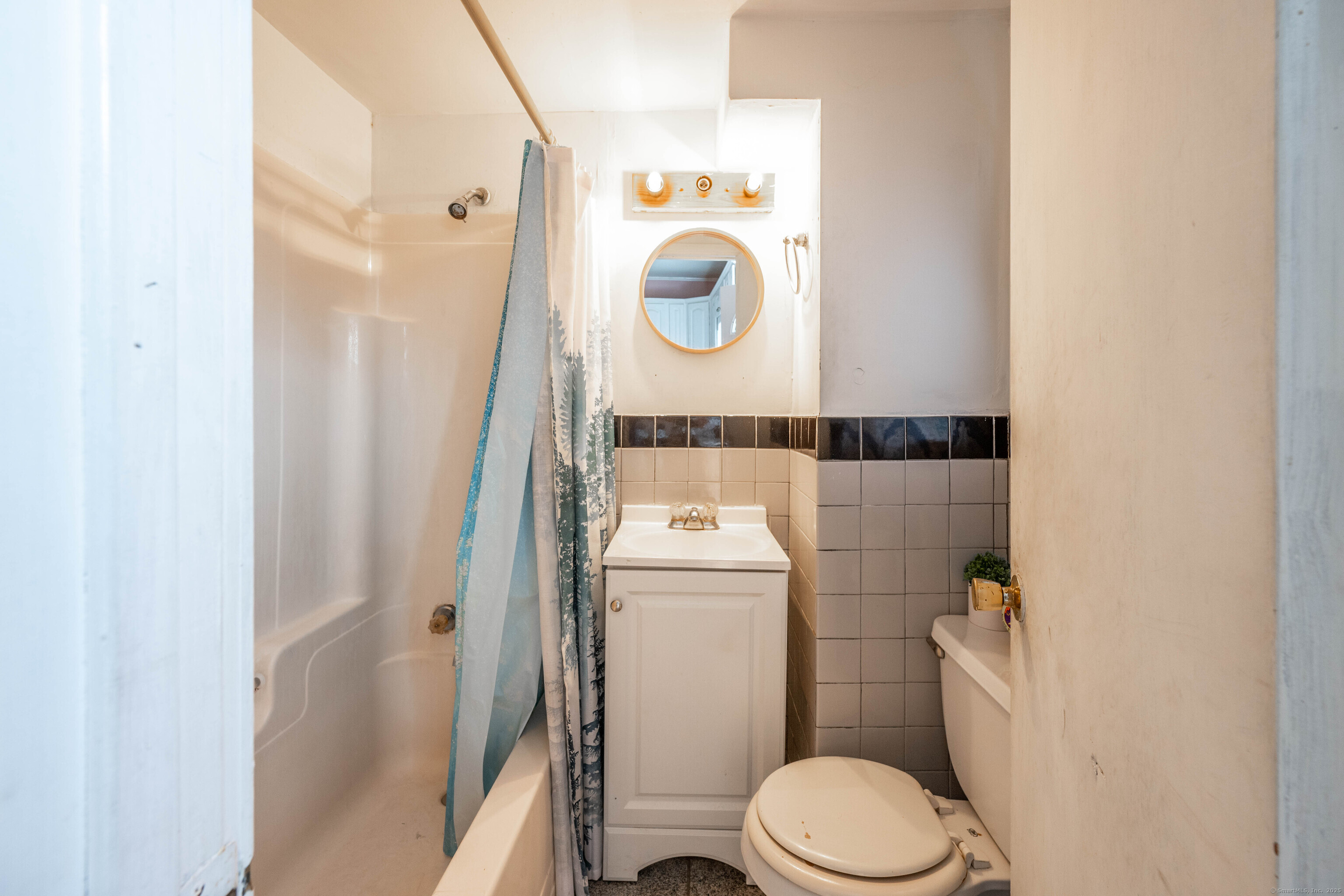 5 Patch Street Danbury, CT 06810 - Photo 10 of 21 a white toilet sitting next to a bathroom sink