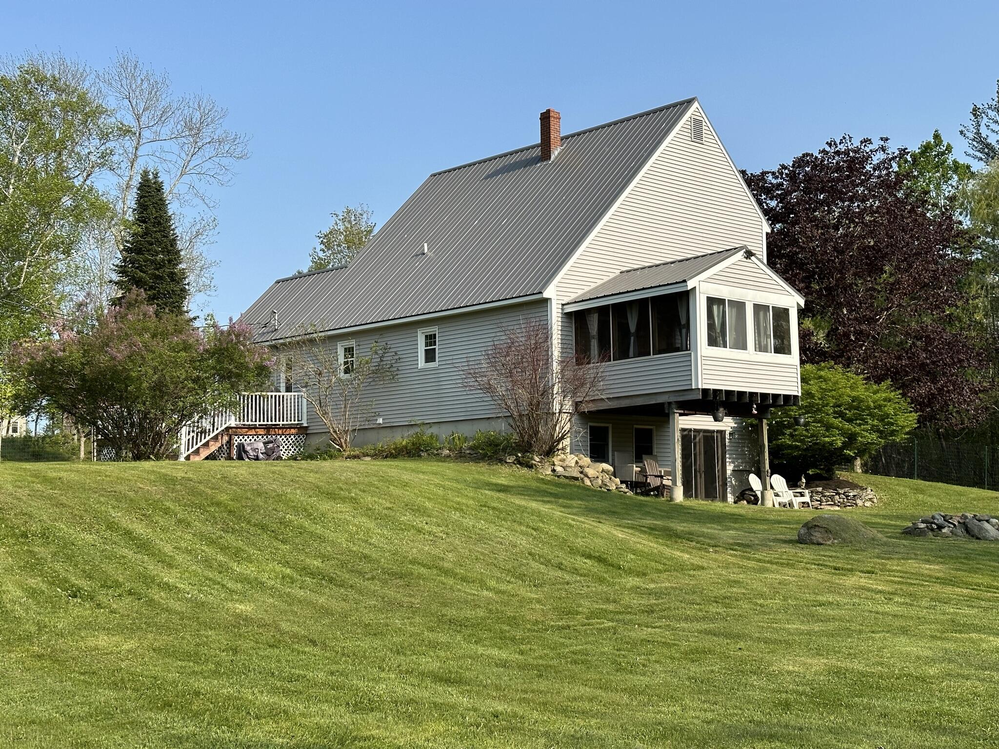 143 Bessey Ridge Road Albion, ME 04910 - Photo 2 of 53 143 Bessey Ridge backyard