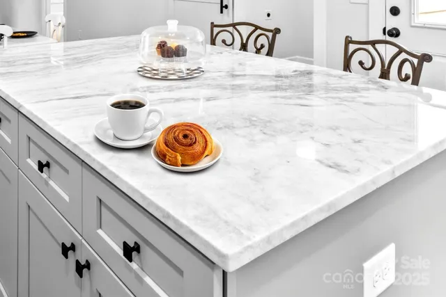 a kitchen with a stove and cabinets