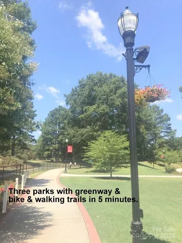 a view of a water fountain and a big yard