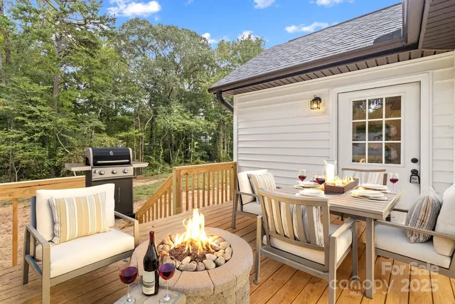 a view of a patio with a table and chairs