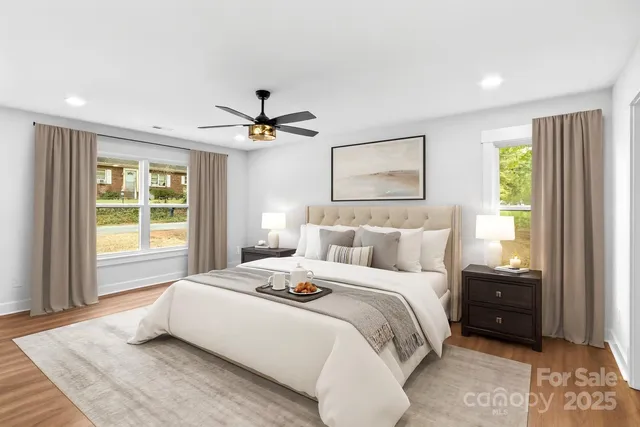 a bedroom with a large bed and a window