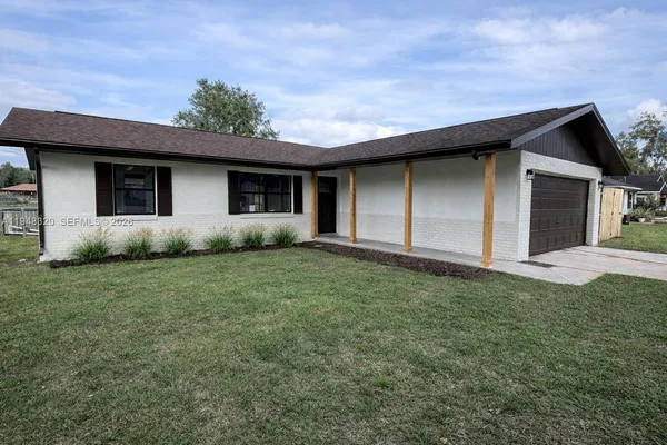 a house view with a garden space